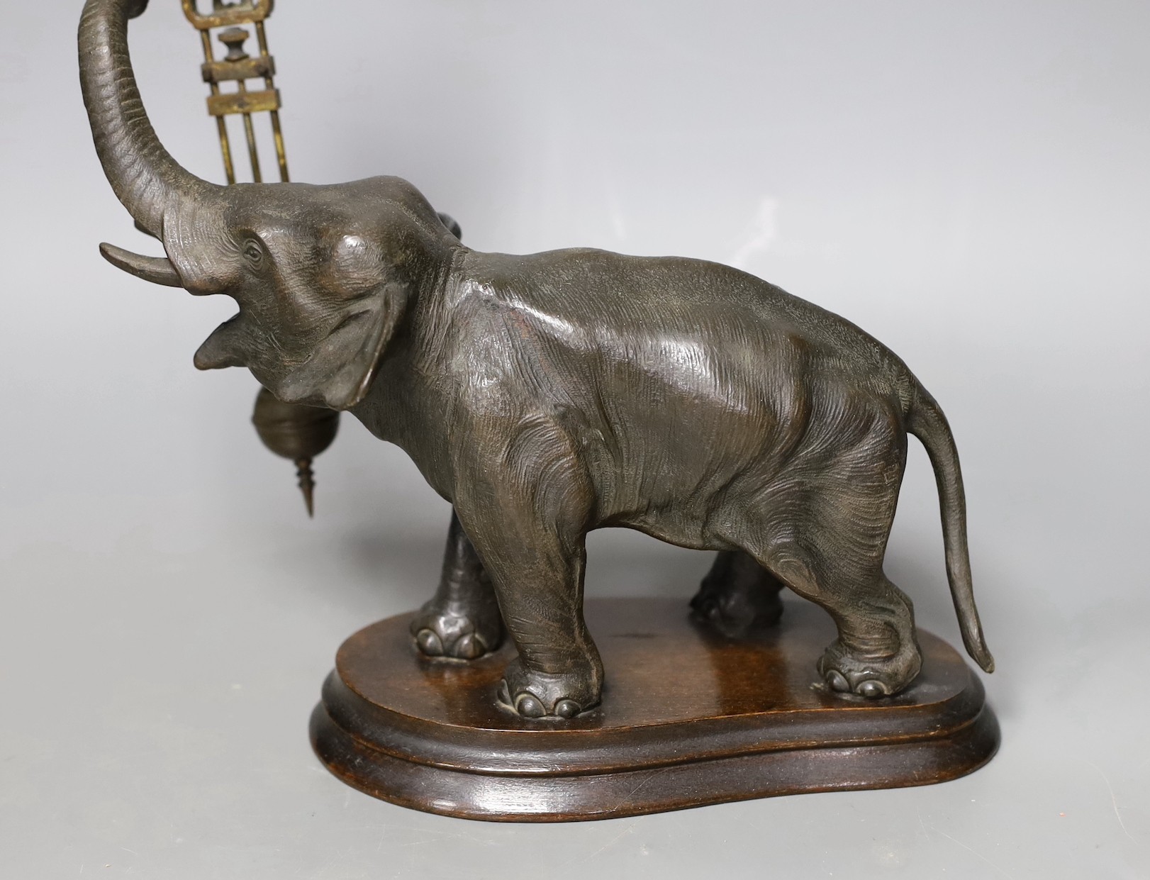 A patinated spelter ‘elephant’ mystery’ timepiece, 29cms high